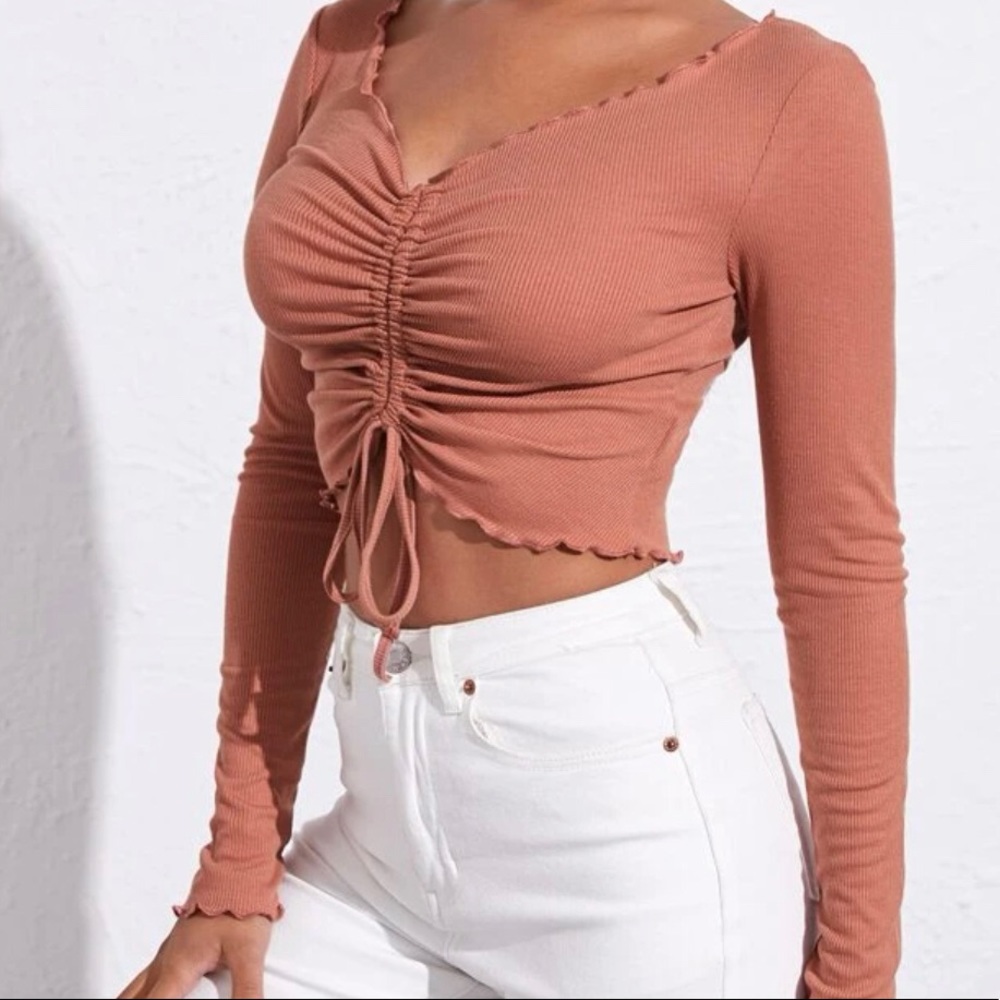 Pink rubbed long sleeve crop top